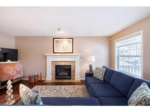 107 Arbour Meadows Close Nw, Calgary, AB - Indoor Photo Showing Living Room With Fireplace