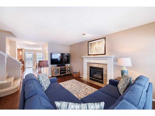 107 Arbour Meadows Close Nw, Calgary, AB - Indoor Photo Showing Living Room With Fireplace