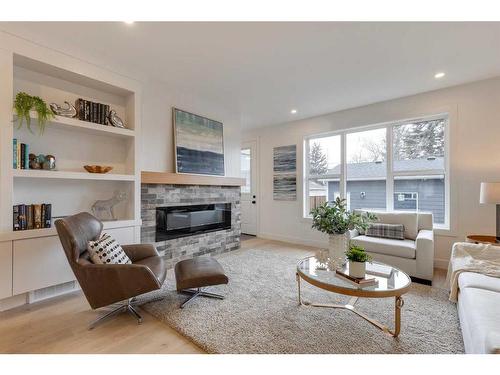 4909 19 Avenue Nw, Calgary, AB - Indoor Photo Showing Living Room With Fireplace