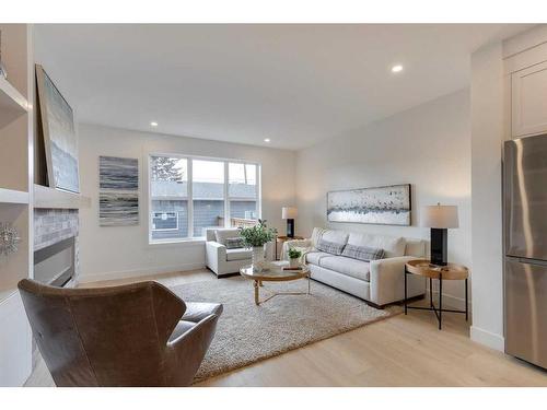 4909 19 Avenue Nw, Calgary, AB - Indoor Photo Showing Living Room With Fireplace