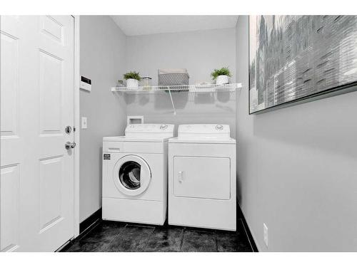 446 Panamount Boulevard Nw, Calgary, AB - Indoor Photo Showing Laundry Room