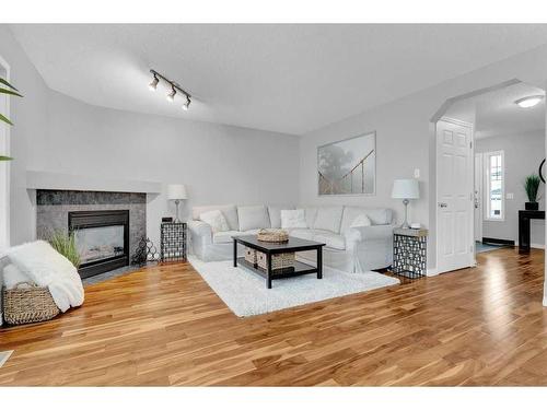 446 Panamount Boulevard Nw, Calgary, AB - Indoor Photo Showing Living Room With Fireplace