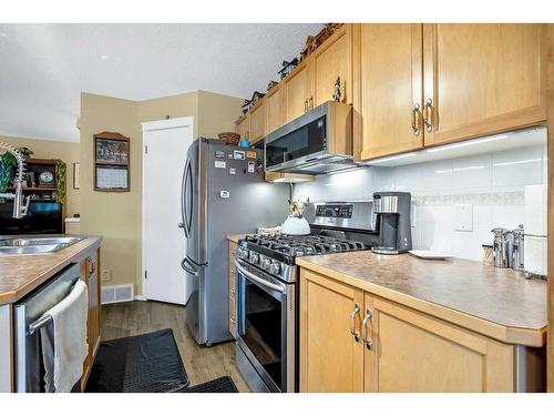 144 Prestwick Avenue Se, Calgary, AB - Indoor Photo Showing Kitchen With Stainless Steel Kitchen With Double Sink