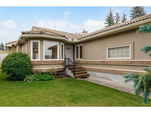 10 Glenmore Green Sw, Calgary, AB - Outdoor With Deck Patio Veranda With Facade