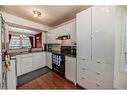 501 Signal Hill Green Sw, Calgary, AB  - Indoor Photo Showing Kitchen With Double Sink 