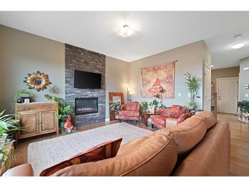 292 Ranch Close, Strathmore, AB - Indoor Photo Showing Living Room With Fireplace