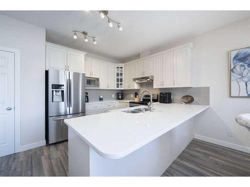 110-2 Westbury Place Sw, Calgary, AB - Indoor Photo Showing Kitchen With Double Sink