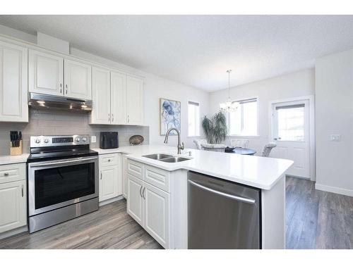 110-2 Westbury Place Sw, Calgary, AB - Indoor Photo Showing Kitchen With Double Sink