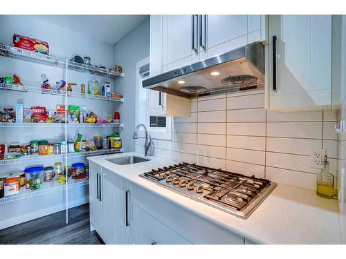 937 Midtown Avenue Sw, Airdrie, AB - Indoor Photo Showing Kitchen