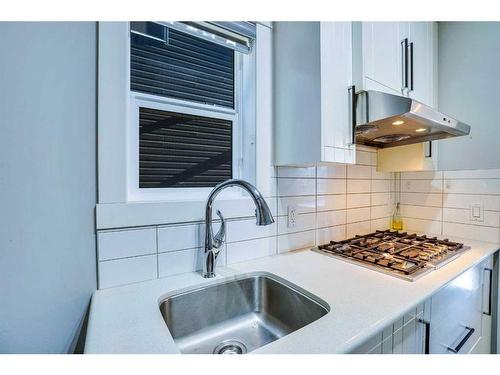 937 Midtown Avenue Sw, Airdrie, AB - Indoor Photo Showing Kitchen