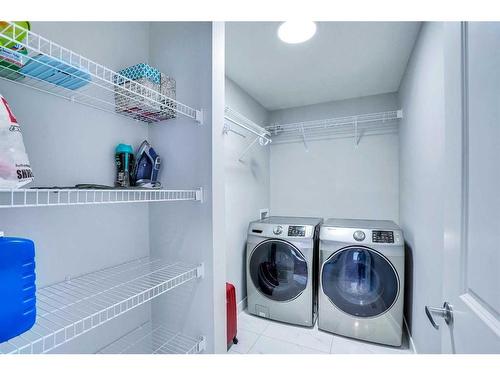 937 Midtown Avenue Sw, Airdrie, AB - Indoor Photo Showing Laundry Room