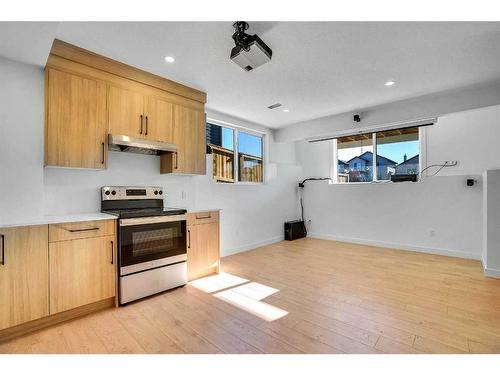 937 Midtown Avenue Sw, Airdrie, AB - Indoor Photo Showing Kitchen