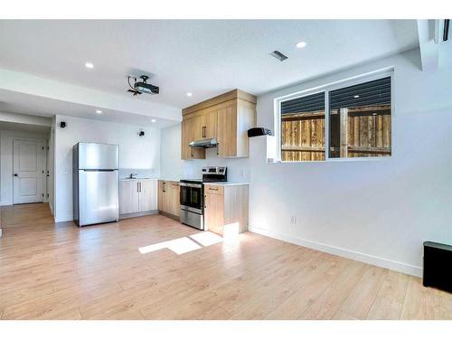 937 Midtown Avenue Sw, Airdrie, AB - Indoor Photo Showing Kitchen