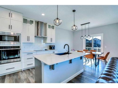 937 Midtown Avenue Sw, Airdrie, AB - Indoor Photo Showing Kitchen With Upgraded Kitchen