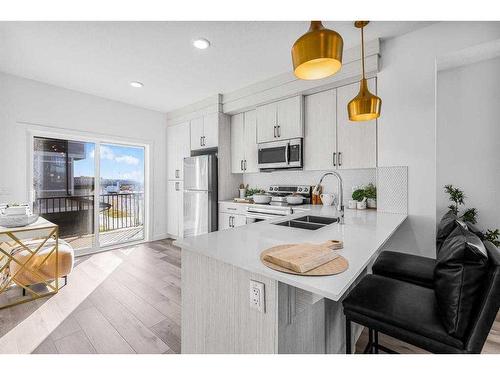 39-29 Cornerstone Row Ne, Calgary, AB - Indoor Photo Showing Kitchen With Double Sink