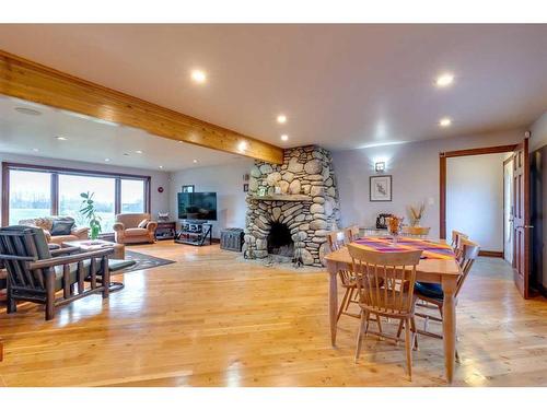 17 Oak Avenue, Okotoks, AB - Indoor Photo Showing Dining Room With Fireplace