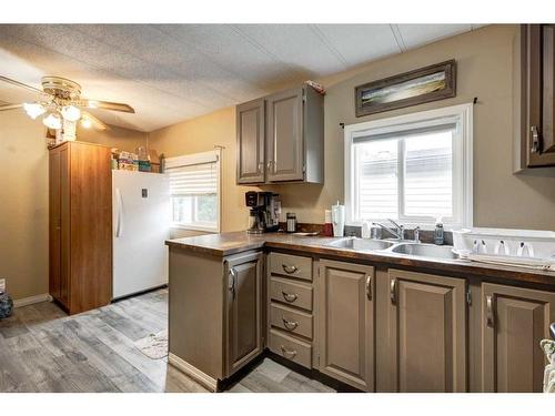 272 Big Hill Circle Se, Airdrie, AB - Indoor Photo Showing Kitchen With Double Sink