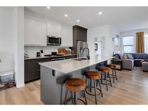 244 Ellen Way, Crossfield, AB - Indoor Photo Showing Kitchen With Stainless Steel Kitchen With Double Sink With Upgraded Kitchen