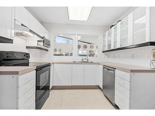 5711 Lawson Place Sw, Calgary, AB - Indoor Photo Showing Kitchen With Double Sink