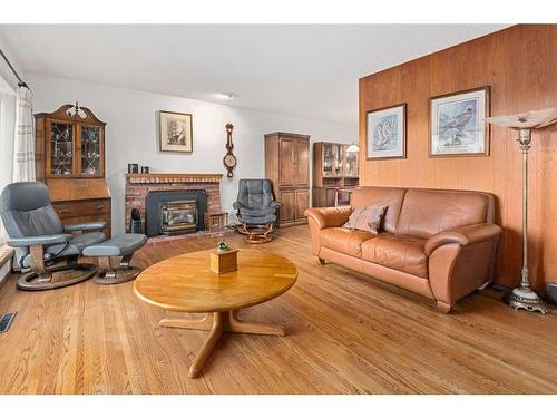 5711 Lawson Place Sw, Calgary, AB - Indoor Photo Showing Living Room With Fireplace