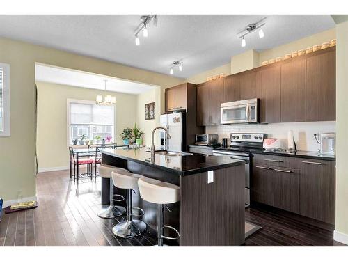 107-300 Marina Drive, Chestermere, AB - Indoor Photo Showing Kitchen With Upgraded Kitchen