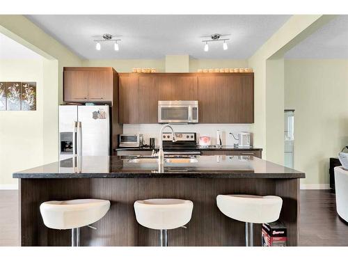 107-300 Marina Drive, Chestermere, AB - Indoor Photo Showing Kitchen With Stainless Steel Kitchen With Upgraded Kitchen