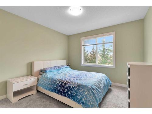 107-300 Marina Drive, Chestermere, AB - Indoor Photo Showing Bedroom