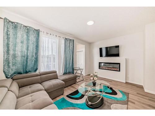 40 Edith Gate Nw, Calgary, AB - Indoor Photo Showing Living Room With Fireplace