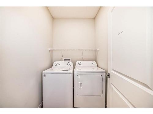 40 Edith Gate Nw, Calgary, AB - Indoor Photo Showing Laundry Room