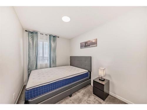 40 Edith Gate Nw, Calgary, AB - Indoor Photo Showing Bedroom