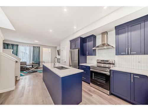 40 Edith Gate Nw, Calgary, AB - Indoor Photo Showing Kitchen With Double Sink