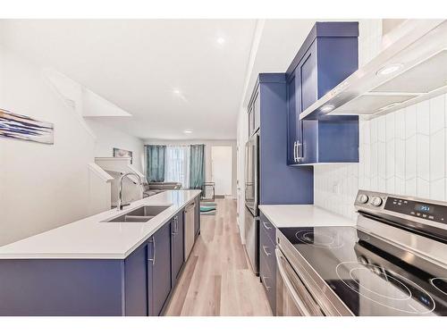 40 Edith Gate Nw, Calgary, AB - Indoor Photo Showing Kitchen With Double Sink With Upgraded Kitchen