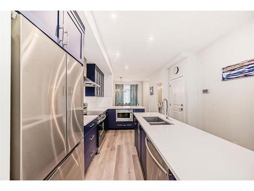 40 Edith Gate Nw, Calgary, AB - Indoor Photo Showing Kitchen With Double Sink With Upgraded Kitchen