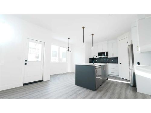 1185 Iron Ridge Avenue, Crossfield, AB - Indoor Photo Showing Kitchen