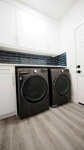 1185 Iron Ridge Avenue, Crossfield, AB - Indoor Photo Showing Laundry Room