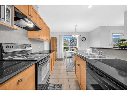 6 Luxstone Point Sw, Airdrie, AB - Indoor Photo Showing Kitchen With Double Sink