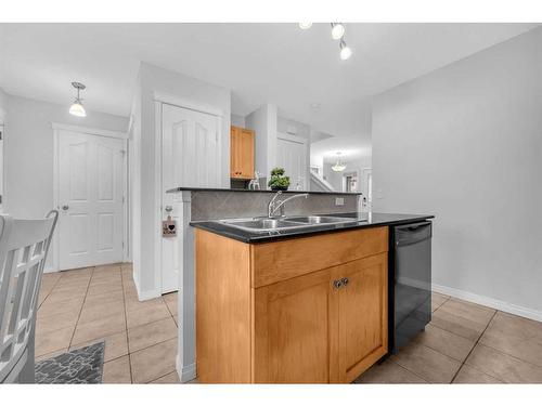 6 Luxstone Point Sw, Airdrie, AB - Indoor Photo Showing Kitchen With Double Sink