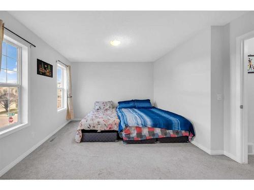 6 Luxstone Point Sw, Airdrie, AB - Indoor Photo Showing Bedroom