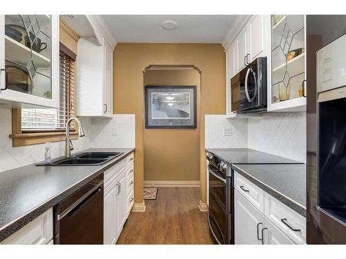 2211 45 Street Se, Calgary, AB - Indoor Photo Showing Kitchen With Double Sink