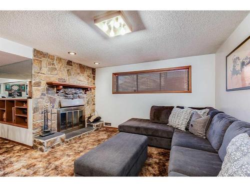 12 Ogmoor Crescent Se, Calgary, AB - Indoor Photo Showing Living Room With Fireplace