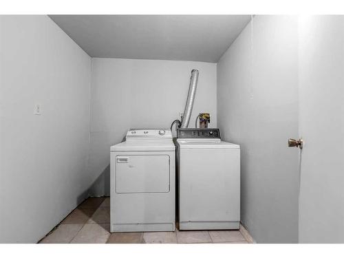 220 Forest Way Se, Calgary, AB - Indoor Photo Showing Laundry Room