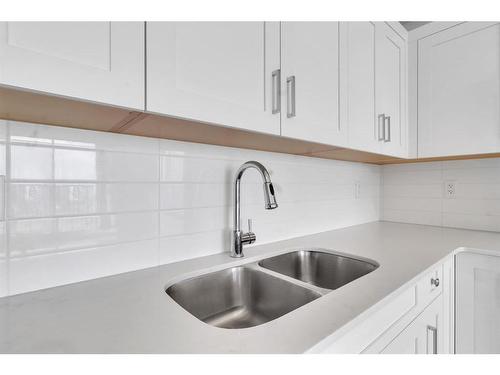 406-30 Sage Hill Walk Nw, Calgary, AB - Indoor Photo Showing Kitchen With Double Sink