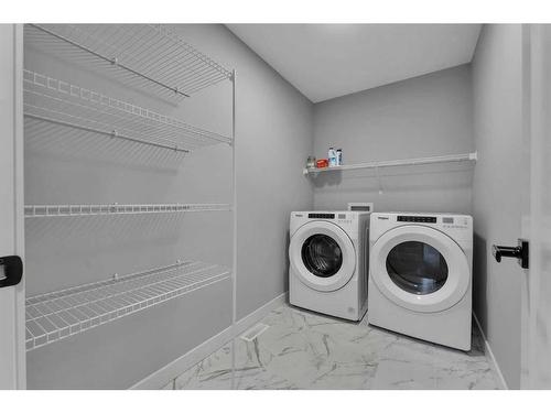 15 Legacy Reach View Se, Calgary, AB - Indoor Photo Showing Laundry Room