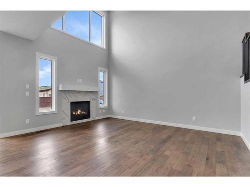 15 Legacy Reach View Se, Calgary, AB - Indoor Photo Showing Other Room With Fireplace