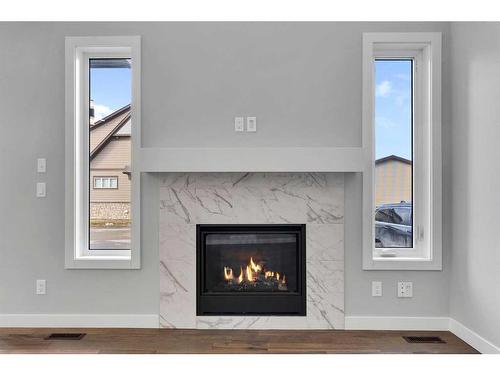 15 Legacy Reach View Se, Calgary, AB - Indoor Photo Showing Living Room With Fireplace