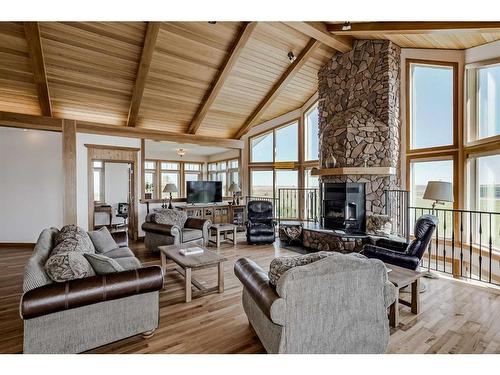 610107 184 Street East, Rural Foothills County, AB - Indoor Photo Showing Living Room With Fireplace