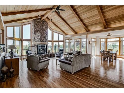 610107 184 Street East, Rural Foothills County, AB - Indoor Photo Showing Living Room With Fireplace