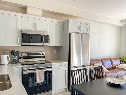 5213-200 Seton Circle Se, Calgary, AB - Indoor Photo Showing Kitchen With Double Sink