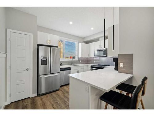 143-301 Redstone Boulevard Ne, Calgary, AB - Indoor Photo Showing Kitchen With Stainless Steel Kitchen With Double Sink