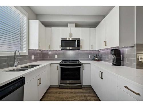 143-301 Redstone Boulevard Ne, Calgary, AB - Indoor Photo Showing Kitchen With Double Sink